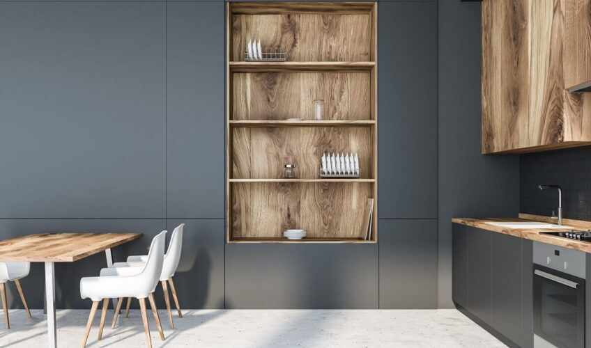 Modern kitchen with wood accents, open shelving, white chairs, and a dining table. Neutral tones create a minimalist look.